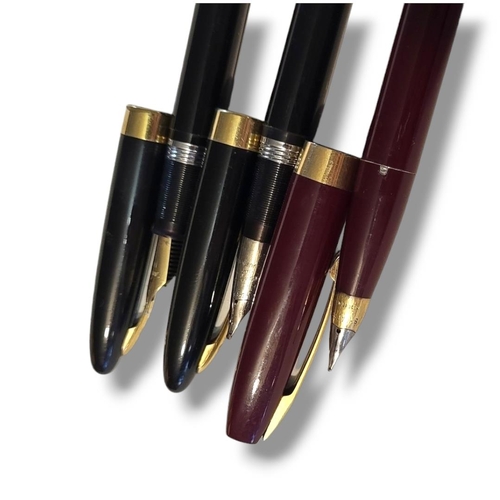 20 - SHEAFFER, THREE VINTAGE FOUNTAIN PENS
Having two black case and one burgundy,each having 14ct golds ... 