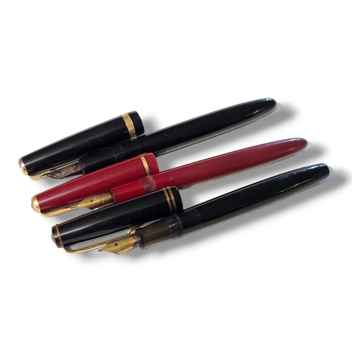 22 - PARKER, TWO VINTAGE FOUNTAIN PENS
Having gold plated mounts two black cases and one burgundy, each h... 