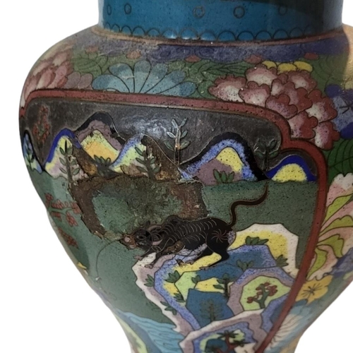 268 - A PAIR OF LATE 19TH/EARLY 20TH CENTURY CHINESE CLOISONNÉ VASE AND COVERS
Decorated with mountain vie... 