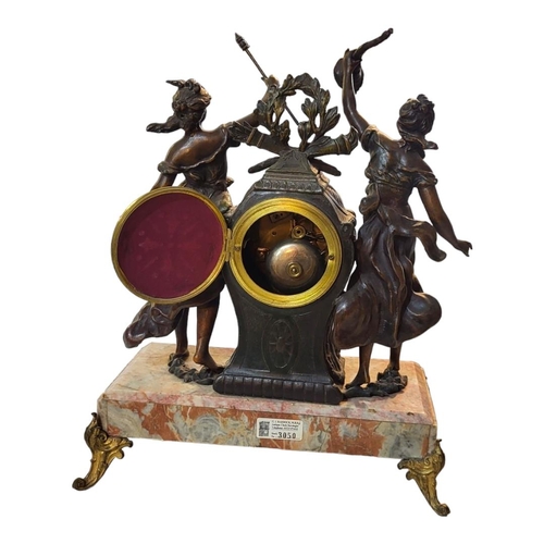 283 - A FRENCH 19TH CENTURY SPELTER AND ROUGE MARBLE FIGURAL CLOCK
Two classical female figures with paint... 