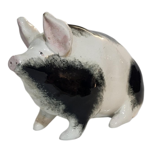 298 - WITHDRAWN AN EARLY 20TH CENTURY WEMYSS POTTERY MODEL OF A PIG
Sponged black and white decoration, Ci... 