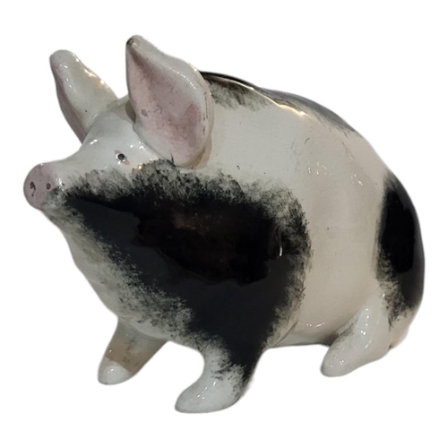 298 - WITHDRAWN AN EARLY 20TH CENTURY WEMYSS POTTERY MODEL OF A PIG
Sponged black and white decoration, Ci... 