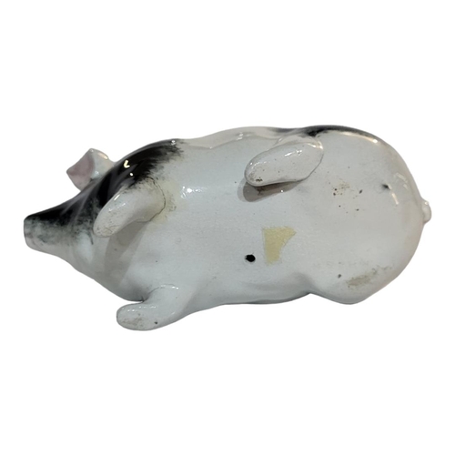 298 - WITHDRAWN AN EARLY 20TH CENTURY WEMYSS POTTERY MODEL OF A PIG
Sponged black and white decoration, Ci... 