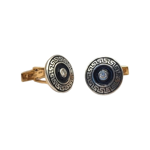 2A - A PAIR OF 14CT GOLD, DIAMOND AND ENAMEL CUFFLINKS
The single round cut diamond in blue enamel with C... 