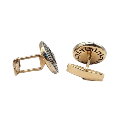 2A - A PAIR OF 14CT GOLD, DIAMOND AND ENAMEL CUFFLINKS
The single round cut diamond in blue enamel with C... 