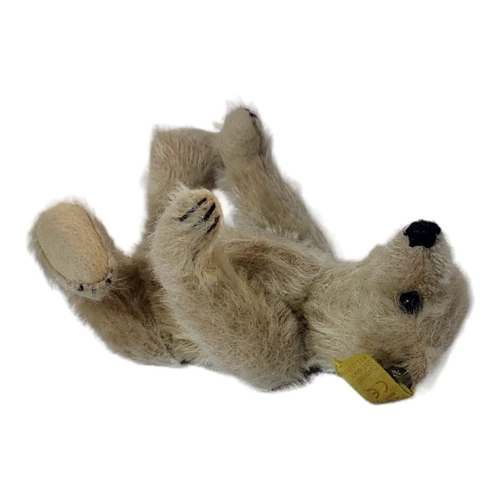 303 - STEIFF, A VINTAGE MOHAIR TEDDY BEAR
Light coloured fur with button and tag to left ear.
(approx 12cm... 