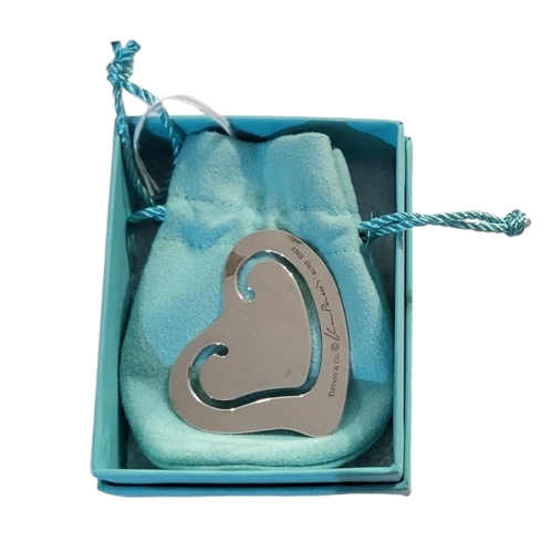 30A - TIFFANY & CO., A SILVER PIERCED HEART FORM BOOKMARK
With original pouch, box and bag, together with ... 