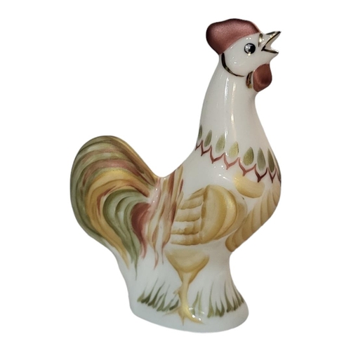 310 - A VINTAGE CONTINENTAL PORCELAIN MODEL OF A ROOSTER
Having hand painted decoration, together with a c... 