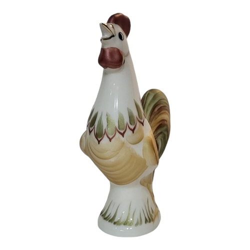 310 - A VINTAGE CONTINENTAL PORCELAIN MODEL OF A ROOSTER
Having hand painted decoration, together with a c... 