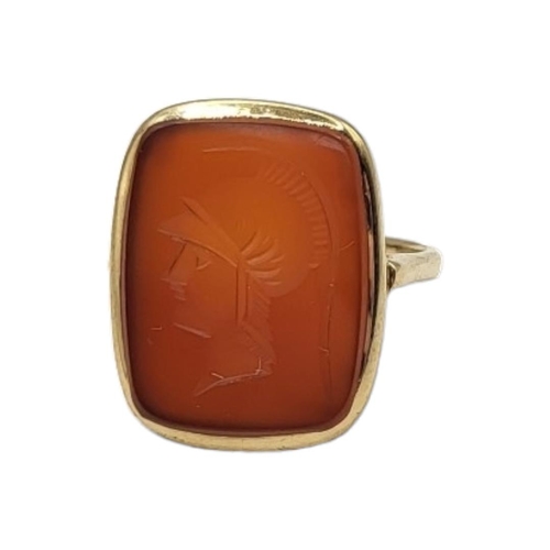 37 - A VINTAGE YELLOW METAL AND CARNELIAN INTAGLIO RING
Rectangular cut stone with classical male portrai... 