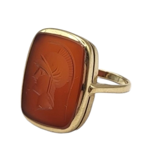 37 - A VINTAGE YELLOW METAL AND CARNELIAN INTAGLIO RING
Rectangular cut stone with classical male portrai... 