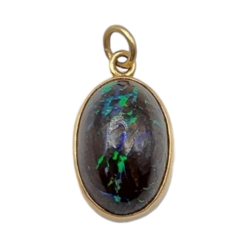 4 - A LATE 19TH/EARLY 20TH CENTURY 15CT GOLD OPAL PENDANT
The cabochon cut opal in a 15ct gold frame.
(o... 