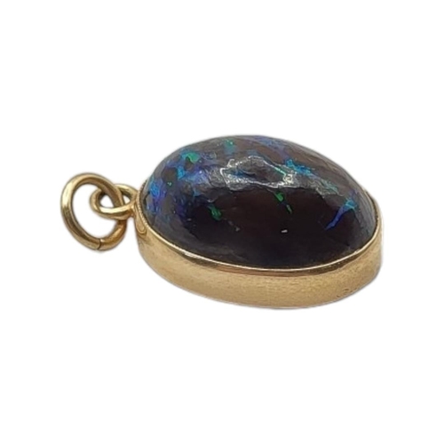 4 - A LATE 19TH/EARLY 20TH CENTURY 15CT GOLD OPAL PENDANT
The cabochon cut opal in a 15ct gold frame.
(o... 