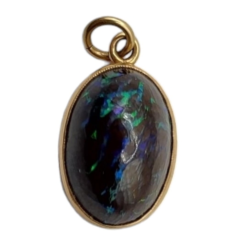 4 - A LATE 19TH/EARLY 20TH CENTURY 15CT GOLD OPAL PENDANT
The cabochon cut opal in a 15ct gold frame.
(o... 