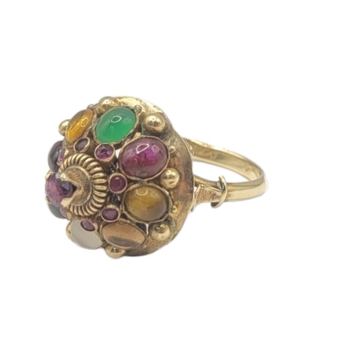 47 - A VINTAGE 14CT GOLD AND MULTI GEM SET TUTTI FRUTTI RING
Having an arrangement of cabochon cut stones... 