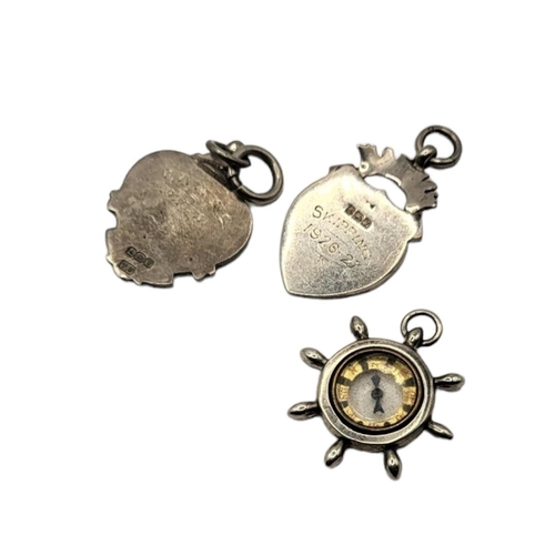 50 - A COLLECTION OF THREE VINTAGE SILVER POCKET WATCH FOBS
To include a compass ship's wheel and a fob w... 