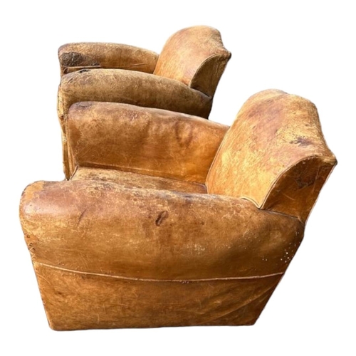 508 - A PAIR FRENCH ART DECO CLUB ARMCHAIRS
In distressed tan leather upholstery.
(w 69cm x d 70cm x h 75c... 