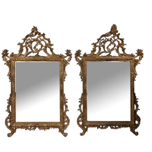 572 - A PAIR OF 18TH CENTURY STYLE CHIPPENDALE INSPIRED GILTWOOD FRAMED MIRRORS
With elaborate carved and ... 