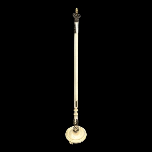 610 - AN EARLY 20TH CENTURY BRONZE AND CREAM PAINTED STANDARD LAMP
With cast Corinthian capital on fluted ... 