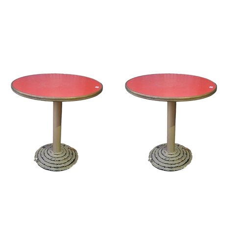 613 - A PAIR OF STYLISH ART DECO DESIGN CAFE TABLES
With red circular tops raised on single columns standi... 