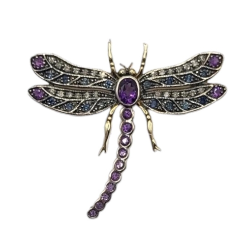 6A - A YELLOW METAL, AMETHYST AND DIAMOND DRAGONFLY BROOCH
Having an arrangement of graduated stones.
(ap... 