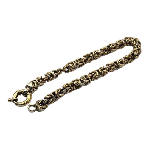 83 - A VINTAGE 9CT GOLD BRACELET
Having textured pierced links and circular clasp.
(approx 20cm)

Conditi... 