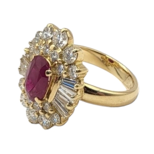 8A - A VINTAGE 18CT GOLD, RUBY AND DIAMOND CLUSTER RING
The central oval cut ruby in an arrangement of ba... 