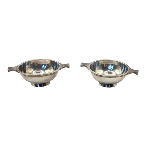 91 - A PAIR OF EARLY 20TH CENTURY SCOTTISH SILVER QUAICH BOWLS
Twin handles, hallmarked Hamilton and Inch... 