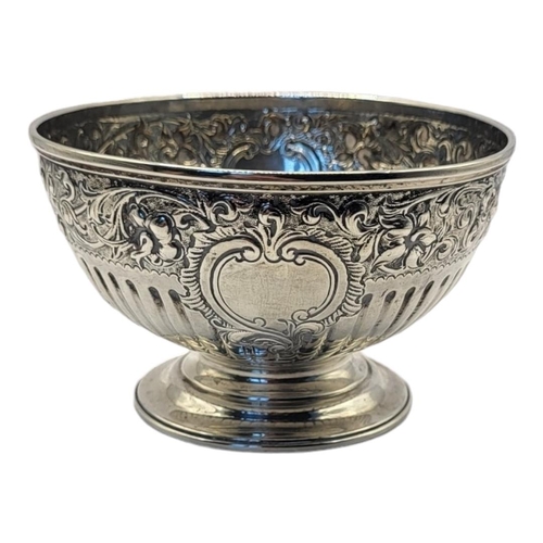 92 - A GEORGIAN SILVER SUGAR BASIN
Having embossed scrolled decoration with flutes and stepped circular b... 