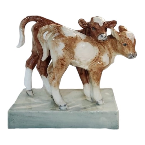 203A - DORIS LINDNER FOR ROYAL WORCESTER, A BONE CHINA FIGURAL GROUP OF YOUNG CALVES
Modelled by Lindner fo... 