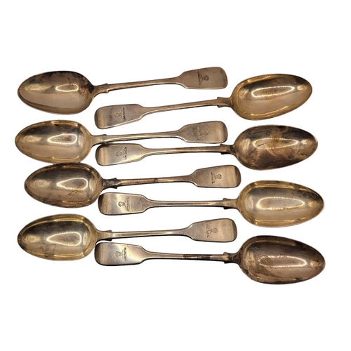 1 - A SET OF EIGHT GEORGIAN SILVER TABLESPOONS
Plain fiddle pattern with engraved family crest, hallmark... 