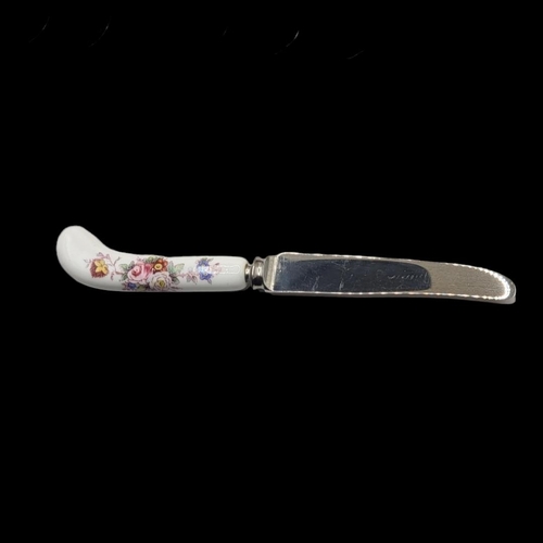 16 - ROYAL CROWN DERBY, A VINTAGE SET OF PORCELAIN HANDLED DESSERT KNIVES 
Of pistol grip design with flo... 