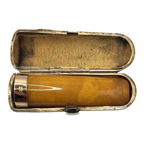 26 - A VICTORIAN 15CT GOLD AND BUTTERSCOTCH AMBER CIGARETTE HOLDER
In a Victorian silver holder, marked L... 