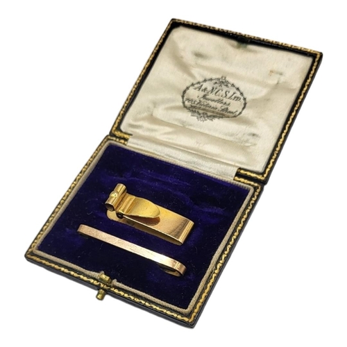 30 - AN EARLY 20TH CENTURY 9CT GOLD GENT’S MONEY CLIP
Rectangular form with hinged mount, together with a... 