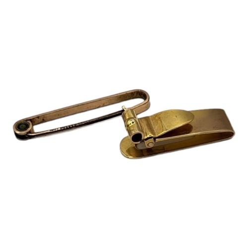 30 - AN EARLY 20TH CENTURY 9CT GOLD GENT’S MONEY CLIP
Rectangular form with hinged mount, together with a... 