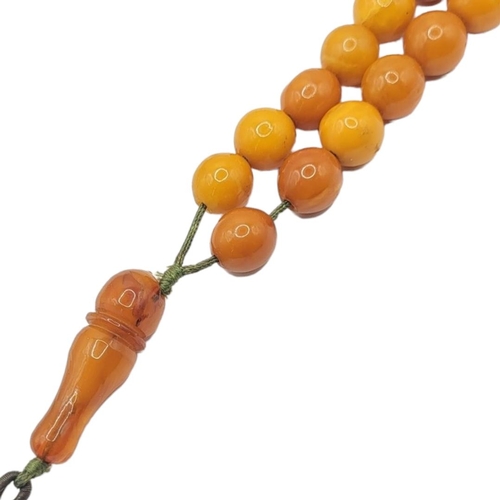 31 - AN EARLY 20TH CENTURY BUTTERSCOTCH AMBER NECKLACE
Graduated beads with carved toggle.
(approx 30cm)
... 