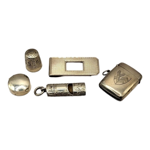 33 - A COLLECTION OF EARLY 20TH CENTURY SILVER TRINKETS
To include a money clip, vesta case with engraved... 