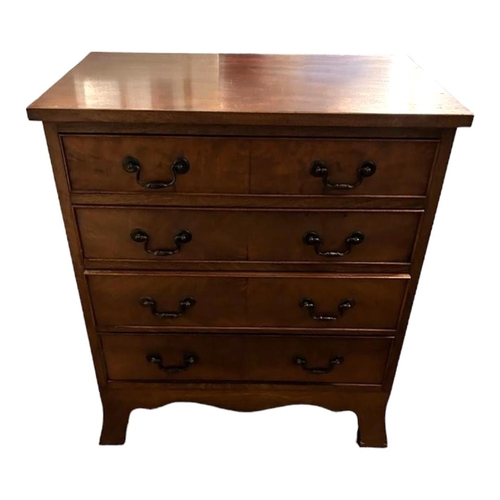 590 - A GEORGIAN STYLE MAHOGANY CHEST
Having an arrangement of four long drawers, with shaped apron, stand... 