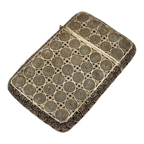 8 - AN EARLY 20TH CENTURY CONTINENTAL SILVER FILIGREE CIGARETTE CASE
Fine wirework in a circular design.... 