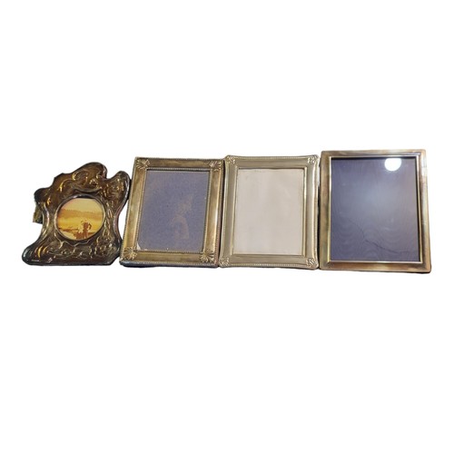 12 - A COLLECTION OF FOUR 20TH CENTURY SILVER PHOTOGRAPH FRAMES
To include an embossed frame with Art Nou... 