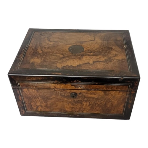 340 - A MID VICTORIAN BURR WALNUT VENEERED WRITING STATIONERY BOX AND COVER
Fall front enclosing a velvet ... 