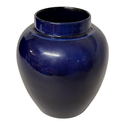 319 - A 1930’S WILLIAM MOORCROFT POTTERY MIDNIGHT BLUE LUSTRE GROUND VASE/JAR
Green signature, impressed p... 