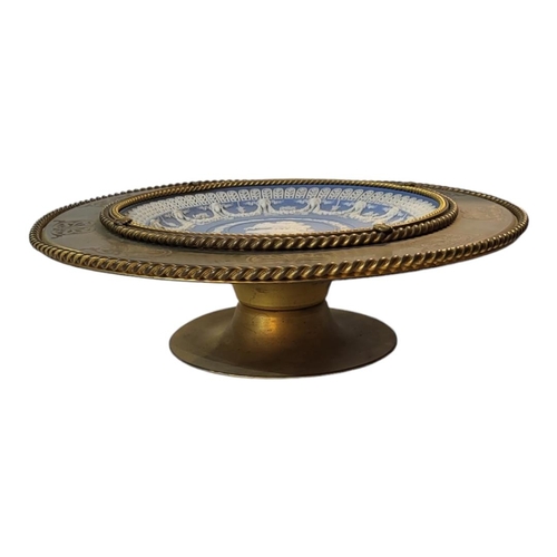 362 - A 19TH CENTURY GILDED BRONZE TAZZA
Centrally set with Wedgwood Jasperware blue and white Neoclassica... 