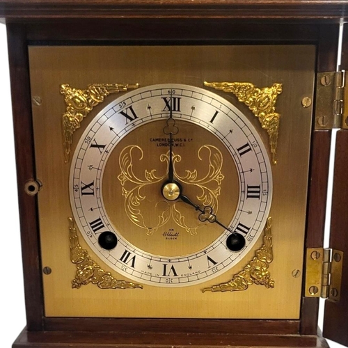 380 - ELLIOT OF LONDON, A 20TH CENTURY WALNUT AND BRASS MANTEL CLOCK
Having a single brass handle,square d... 