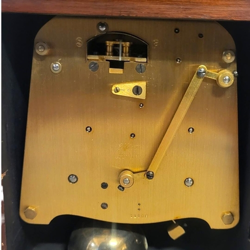 380 - ELLIOT OF LONDON, A 20TH CENTURY WALNUT AND BRASS MANTEL CLOCK
Having a single brass handle,square d... 