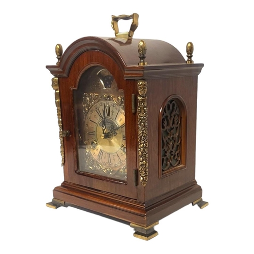 381 - WARMINK, A 20TH CENTURY MAHOGANY AND BRASS MANTEL CLOCK
Single brass handle with acorn finials and b... 