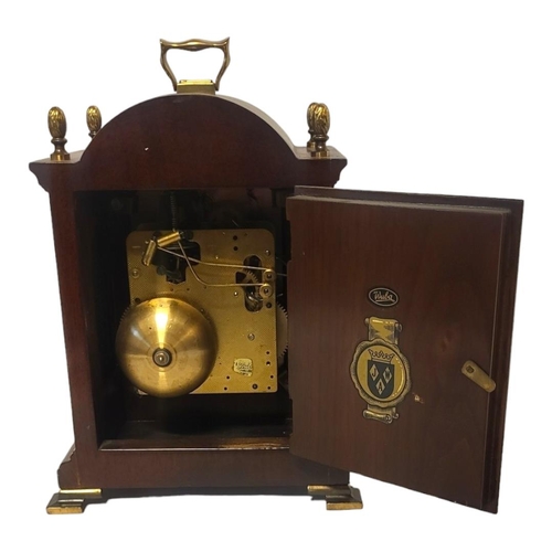 381 - WARMINK, A 20TH CENTURY MAHOGANY AND BRASS MANTEL CLOCK
Single brass handle with acorn finials and b... 