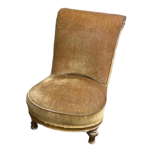 467 - A VICTORIAN GILTWOOD FRAMED NURSING CHAIR
In a faded velvet fabric, on melon section turned legs wit... 