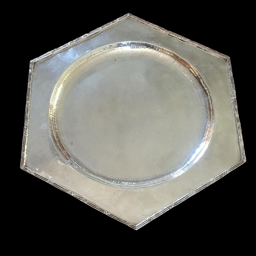 105 - ARTISTICO, A VINTAGE CONTINENTAL WHITE METAL SALVER TRAY
Hexagonal form with reeded edge and planish... 