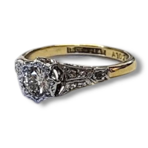 106 - AN EARLY 20TH CENTURY 18CT GOLD AND DIAMOND SOLITAIRE RING
Having a single round cut diamond and dia... 